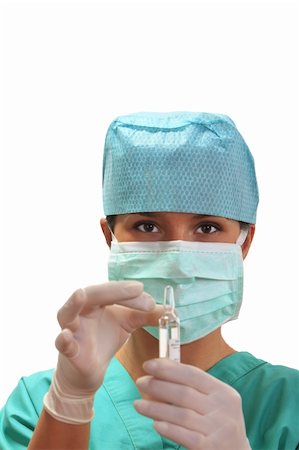 Female doctor preparing a vial with a clear solution.Selective focus on the face. Stock Photo - Budget Royalty-Free & Subscription, Code: 400-04800677