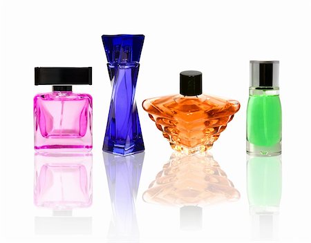 Perfume color glass bottles isolated on white with transparant relection. Stock Photo - Budget Royalty-Free & Subscription, Code: 400-04802616