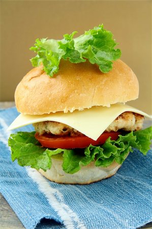 simsearch:400-06090558,k - Cheeseburger with cheese and tomatoes on a stylish denim napkins Stock Photo - Budget Royalty-Free & Subscription, Code: 400-04803828