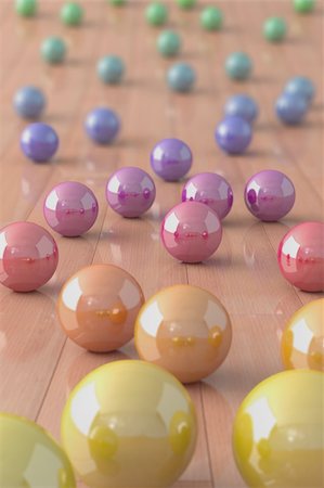 High quality 3d image of colorful marble balls on a parquet floor Stock Photo - Budget Royalty-Free & Subscription, Code: 400-04814165