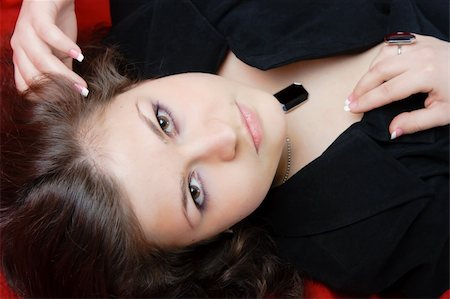 simsearch:400-04653285,k - attractive sexy brunette in a black dress. Studio portrait Photographie de stock - Aubaine LD & Abonnement, Code: 400-04814580