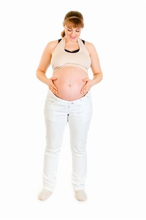 simsearch:400-04817039,k - Beautiful pregnant woman holding her belly isolated on white background Stock Photo - Budget Royalty-Free & Subscription, Code: 400-04817037