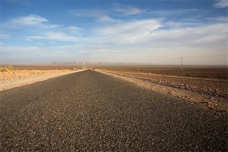 future of the desert - Straight road with nice blue sky in the south of Morocco Stock Photo - Budget Royalty-Free & Subscription, Code: 400-04817149