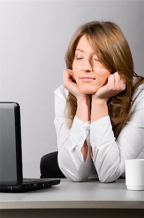 sleeping in class pictures blacks - business woman is sitting in the office with laptop and sleeping with head on hands Stock Photo - Budget Royalty-Free & Subscription, Code: 400-04818085