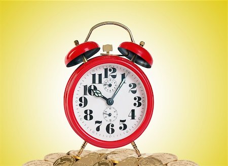 sleeping in class pictures blacks - Alarm clock with golden coins on yellow background Stock Photo - Budget Royalty-Free & Subscription, Code: 400-04818178