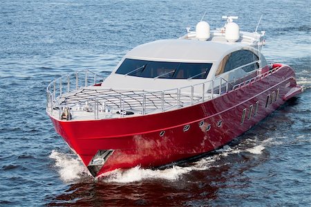 Luxury red speed boat with water splashes Stock Photo - Budget Royalty-Free & Subscription, Code: 400-04818762