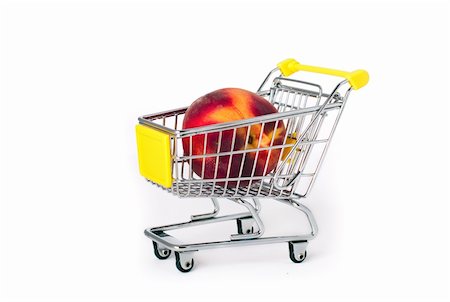 simsearch:400-04321973,k - Shopping cart with a large peach on white background Stock Photo - Budget Royalty-Free & Subscription, Code: 400-04810288