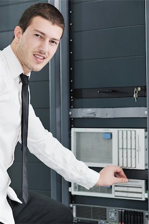 simsearch:400-05881495,k - young handsome business man it  engeneer in datacenter server room Stock Photo - Budget Royalty-Free & Subscription, Code: 400-04811186