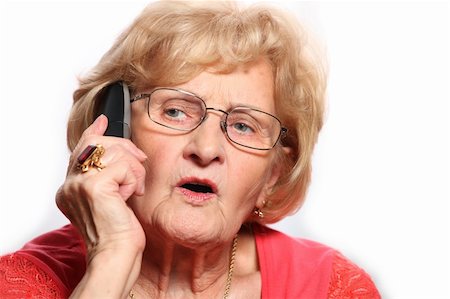 senior woman caucasian beautiful hair - A portrait of an elderly lady talking on the phone against white background Stock Photo - Budget Royalty-Free & Subscription, Code: 400-04811360