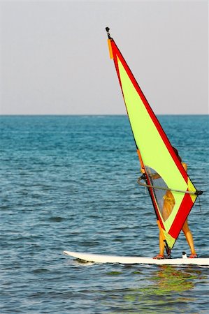 simsearch:400-03992760,k - windsurfer, blue sea and yellow sail Stock Photo - Budget Royalty-Free & Subscription, Code: 400-04811516