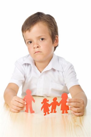 Divorce concept with sad kid holding separated paper people family - isolated Stock Photo - Budget Royalty-Free & Subscription, Code: 400-04811558