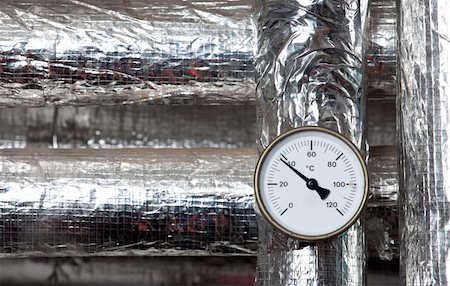 a thermometer mounted on some temperature-isolated pipes Stock Photo - Budget Royalty-Free & Subscription, Code: 400-04813544