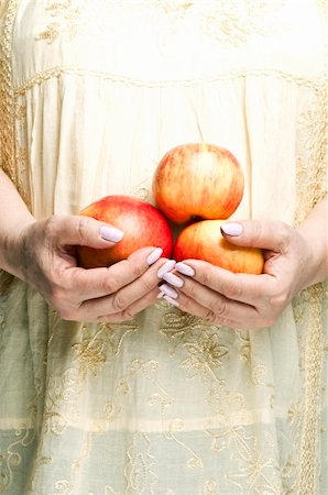 Housewife holding bunch of apples Stock Photo - Budget Royalty-Free & Subscription, Code: 400-04813972