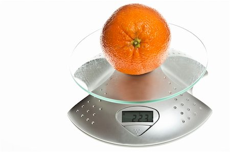 simsearch:400-04647880,k - Orange fruit isolated on food scale Stock Photo - Budget Royalty-Free & Subscription, Code: 400-04813984