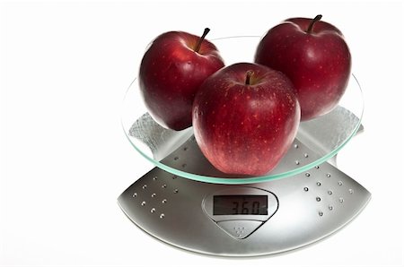 simsearch:400-04647880,k - Red apples isolated on food scale Stock Photo - Budget Royalty-Free & Subscription, Code: 400-04813986