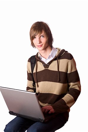 simsearch:400-05734244,k - Young man doing homework on own laptop isolated on white Stock Photo - Budget Royalty-Free & Subscription, Code: 400-04824154