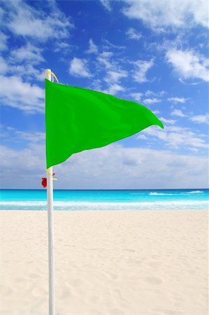 simsearch:400-04329339,k - Beach green flag good weather wind Caribbean turquoise sea Stock Photo - Budget Royalty-Free & Subscription, Code: 400-04825363
