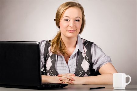 plump girls - young woman is working on laptop  at office Stock Photo - Budget Royalty-Free & Subscription, Code: 400-04829271