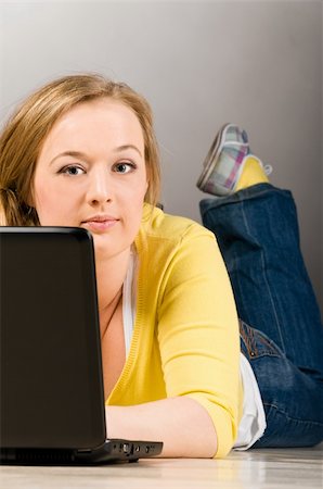 plump girls - young lying woman is working on laptop on floor Stock Photo - Budget Royalty-Free & Subscription, Code: 400-04829273