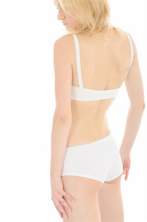 pot belly - Part of beautiful fit slim woman body in white underwear from the back. isolated Foto de stock - Super Valor sin royalties y Suscripción, Código: 400-04829840