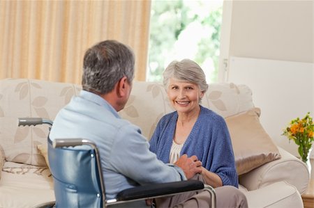 Senior couple talking in the living room at home Stock Photo - Budget Royalty-Free & Subscription, Code: 400-04829906