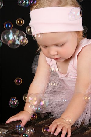 Baby ballerina playing amongst lots of bubbles Stock Photo - Budget Royalty-Free & Subscription, Code: 400-04820210