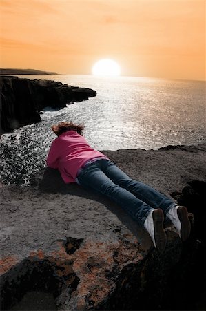 simsearch:400-07091395,k - lone woman on the cliffs edge on a rocky landscape of the burren in county clare ireland Foto de stock - Super Valor sin royalties y Suscripción, Código: 400-04820282