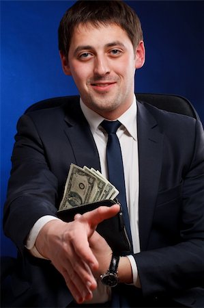 simsearch:400-05715207,k - Businessman with money   gesturing welcome sign Stock Photo - Budget Royalty-Free & Subscription, Code: 400-04822738