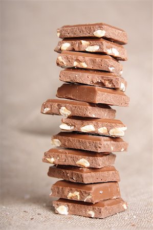 simsearch:400-05136453,k - Sweet chocolate stack on canvas (chocolate with nuts) Stock Photo - Budget Royalty-Free & Subscription, Code: 400-04823614
