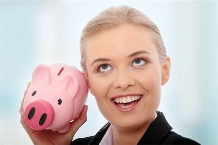 rich women with money laughing - Businesswoman holding piggy bank. Isolated on white background Stock Photo - Budget Royalty-Free & Subscription, Code: 400-04836215