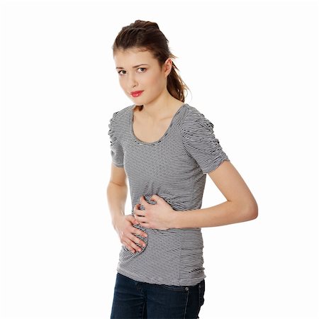 Teen woman with stomach issues,isolated on white Stock Photo - Budget Royalty-Free & Subscription, Code: 400-04836213