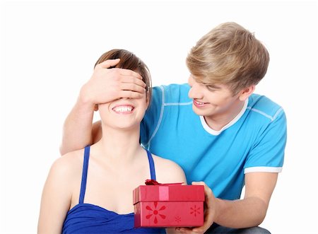 simsearch:400-04739802,k - Boy give a gift to his girlfriend. Isolated on white background. Stock Photo - Budget Royalty-Free & Subscription, Code: 400-04836295