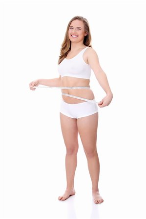 simsearch:400-07219376,k - Female measuring her body, isolated on white Stock Photo - Budget Royalty-Free & Subscription, Code: 400-04836622