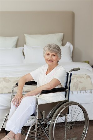 Smiling senior woman in her wheelchair at home Stock Photo - Budget Royalty-Free & Subscription, Code: 400-04830301