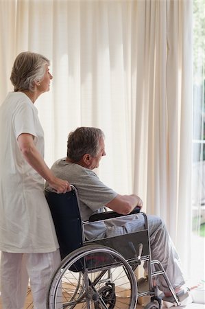 Retired couple looking out the window Stock Photo - Budget Royalty-Free & Subscription, Code: 400-04830637