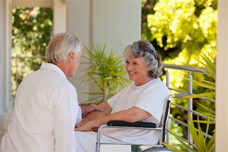 elder care - Doctor with his patient in her wheelchair Stock Photo - Budget Royalty-Free & Subscription, Code: 400-04830679