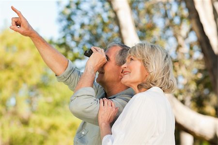 Couple looking at the sky with their binoculars Stock Photo - Budget Royalty-Free & Subscription, Code: 400-04830988