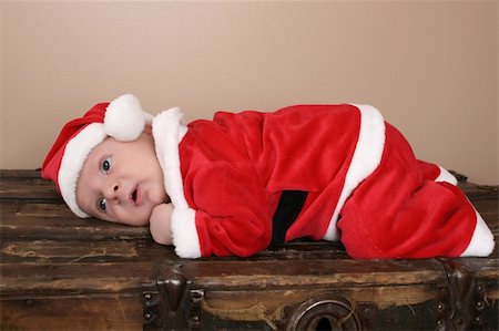 Beautiful six week old baby boy wearing a Christmas suit Stock Photo - Budget Royalty-Free & Subscription, Code: 400-04831133