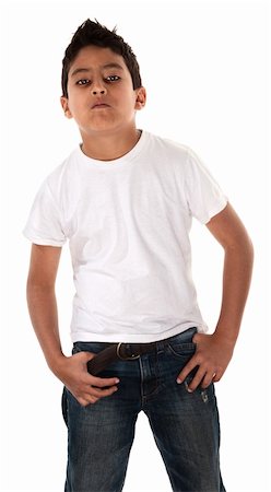 Young Hispanic child in t-shirt and hands pockets with an attitude Stock Photo - Budget Royalty-Free & Subscription, Code: 400-04831183