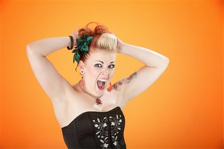 simsearch:400-04831298,k - Middle-aged punk rocker in shock with hands up and shouting Stock Photo - Budget Royalty-Free & Subscription, Code: 400-04831292