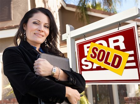 simsearch:693-03308239,k - Proud, Attractive Hispanic Female Agent In Front of Sold For Sale Real Estate Sign and House. Stock Photo - Budget Royalty-Free & Subscription, Code: 400-04832094