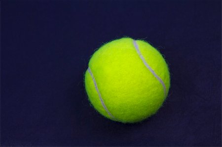 simsearch:400-04833689,k - New Tennis Ball on Blue Court Surface Stock Photo - Budget Royalty-Free & Subscription, Code: 400-04833689
