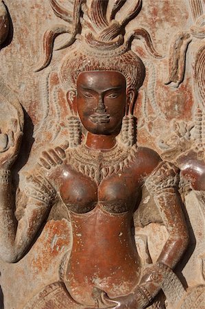 Stone figure of mythological goddes (Apsara) carved on the wall of Angkor temple in Cambodia Stock Photo - Budget Royalty-Free & Subscription, Code: 400-04845185