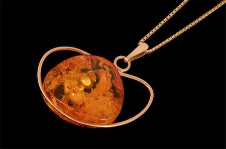 Golden amber necklace on black background isolated Stock Photo - Budget Royalty-Free & Subscription, Code: 400-04847351
