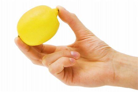 yellow lemon in male hands on a white background Stock Photo - Budget Royalty-Free & Subscription, Code: 400-04841318