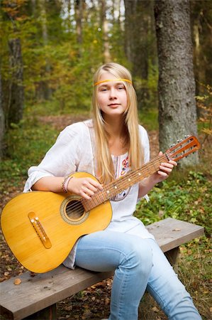 picture of the blue playing a instruments - Beautiful blond guitar player girl in the autumn forest Stock Photo - Budget Royalty-Free & Subscription, Code: 400-04843561