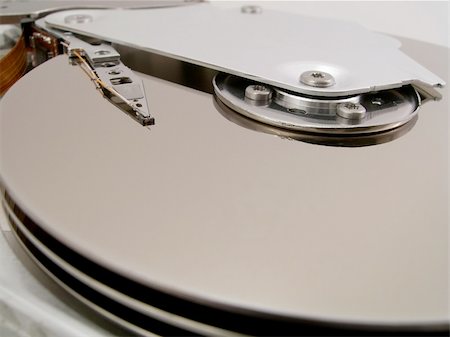 disk drive - Detail of the inside of a computer hard disc unit Stock Photo - Budget Royalty-Free & Subscription, Code: 400-04854377