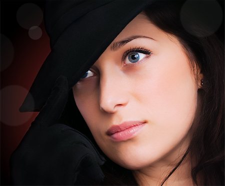 simsearch:400-05693792,k - Portrait of a beautiful brunette young woman with black hat and gloves Stock Photo - Budget Royalty-Free & Subscription, Code: 400-04855397