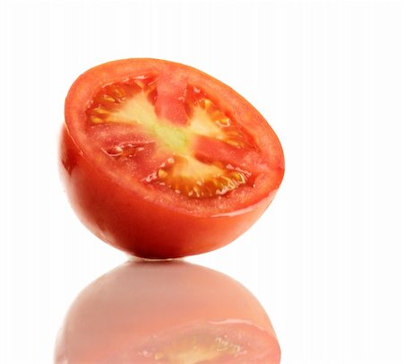 simsearch:400-04386768,k - A Fresh ripe red truss Tomato cut in half isolated on white. Stock Photo - Budget Royalty-Free & Subscription, Code: 400-04858375