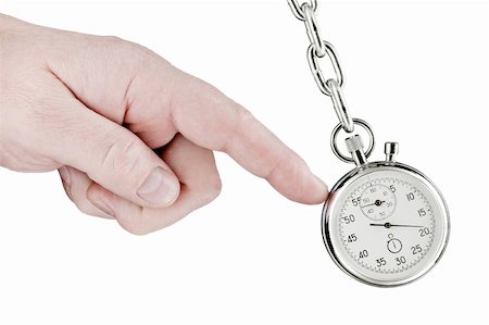 simsearch:400-08494984,k - The hand shifts a pendulum consisting of a stop watch on a chain. Isolated on white [with clipping path]. Stock Photo - Budget Royalty-Free & Subscription, Code: 400-04853096
